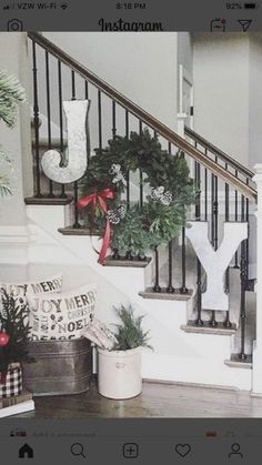 the stairs are decorated with wreaths and christmas decorations