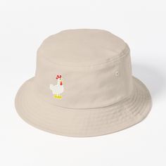 This packable, scrunchable, lightweight headwear classic is ready for adventure, from the beach to the street to the trail Breathable 100% cotton with eyelet ventilation Flat top Moderate brim is 2.2"" (5.5 cm) wide to keep the sun off your face Unstructured crown is 3.1"" (8 cm) deep Easy care: just spot clean and dry in shade. An illustration of a chicken based off of the Supercell game Hay Day. Ootd Bucket Hat, Cute Bucket Hats, Pekin Duck, Chicken Bucket, Bucket Hat Design, White Ducks, Hats For Sale, Cute Cakes, Flats Top