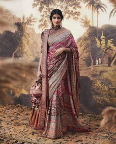 a woman in a red and white sari