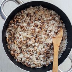 rice and beans are being cooked in a pan