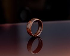 This one-of-a-kind handmade wooden ring is a prime example of finely hand turned craftsmanship. Created with steamed, bent walnut burl veneer, this exquisite band is a unique blend of charm and sophistication. The beautifully figured woodgrain pattern snakes in mesmerizing patterns around the band, and are accentuated by the glossy acrylic finish. The bentwood construction makes this beautiful piece particularly ideal as a wood wedding band, 5th anniversary gift, or just a stylish accessory for casual wear. This unique article of jewelry is not just a ring but a statement of exquisite taste and love for one-of-a-kind pieces. The acrylic finish on this ring is durable and water resistant, however, I do still recommend removing this ring when doing things like showering, swimming, or washing Woodgrain Pattern, Bentwood Rings, Wood Wedding Band, Walnut Burl, Wood Wedding, Ring Hand, 5th Anniversary, Wooden Ring, Wooden Rings