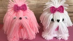 two pink and white dogs with bows on their heads