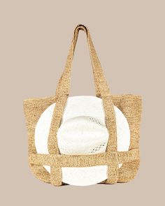 Introducing our Straw Traveler Tote - the perfect accessory to brighten up your spring and summer wardrobe! This versatile bag features a built-in spot to securely store your favorite sunhat while you're on-the-go. With its 100% Raffia Straw material and packable design, this bag is both stylish and functional. It's roomy enough to fit all of your beach day essentials measuring 20" x 14", with a convenient handle drop of 10". Style: 11041 Versatile Straw Bag For Daily Summer Use, Versatile Summer Straw Bag For Daily Use, Summer Beige Crochet Bag With Removable Pouch, Versatile Bags With Adjustable Strap For Vacation, Versatile Vacation Bags With Adjustable Strap, Versatile Vacation Bag With Adjustable Strap, Chic Adjustable Bags For Travel, Beach Bucket Bag With Removable Pouch In Natural Color, Beach Shoulder Bag With Removable Pouch In Natural Color