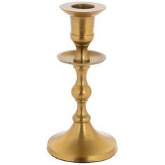 a gold candle holder on a white background