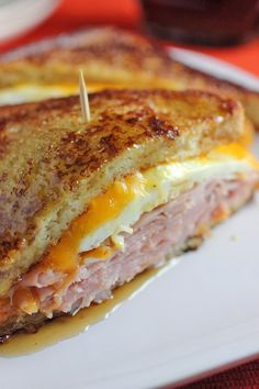 a grilled cheese sandwich on a plate with toothpicks