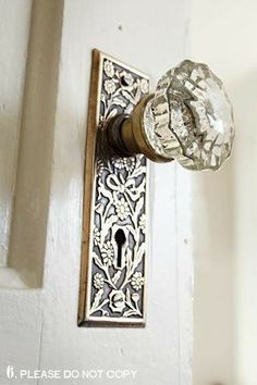 an ornate door handle with a glass knob