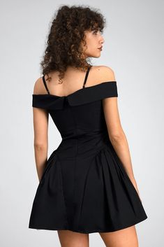 The Off-Shoulder Mini Dress In Black, a stunning ensemble that effortlessly marries timeless elegance with contemporary flair. Crafted with meticulous attention to detail, this dress is designed to make a statement and leave a lasting impression. The off-shoulder neckline delicately frames the shoulders, exuding a sense of femininity and allure. Its graceful silhouette gently skims the curves, flattering the figure with effortless grace. Adorned with a rich black hue, this dress exudes understat Formal Sleeveless Off-shoulder Dress With Fitted Bodice, Fitted Cold Shoulder Formal Dress, Formal Fitted Cold Shoulder Dress, Black Off Shoulder Dress With Fitted Bodice For Party, Formal Off-shoulder Dress, Black Off Shoulder Dress For Evening With Fitted Bodice, Black Off-shoulder Dress With Fitted Bodice For Evening, Fitted Cold Shoulder Off Shoulder Dress For Evening, Fitted Off-shoulder Dress For Formal Occasions