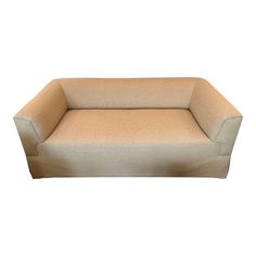 a beige couch sitting on top of a white floor