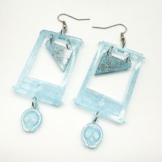 Hand poured resin guillotine earrings with dangling head and blade Super light weight I only have 2 molds so I can never make more than 2 of a kind so you'll have a unique pair of earrings. Hand Poured, Jewelry Earrings Dangle, Dangle Drop Earrings, Dangle Earrings, Jewelry Earrings, Drop Earrings, Blue