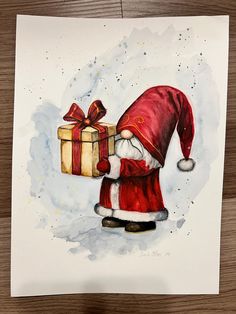 a watercolor painting of santa holding a gift