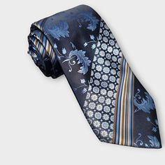 Treat yourself with a new pattern and splash of color to your look with this unique tie set. 100% Silk Handmade Package Includes: Tie, Pocket Square & Cufflinks. Length: 59" Width: 3.34" Warm iron if needed Unique Ties, Cufflink Set, Stripe Silk, Tie Set, Floral Stripe, Tie And Pocket Square, Silk Ties, Pocket Square, Blue Floral