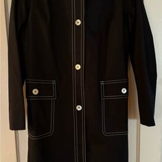 Brand New Worn Once Kors Made In Italy Black Cotton Raincoat With White Trim And Mother Of Pearl Buttons. This Coat Is 96% Cotton And 4% Rayon And Is In Mint Condition. It Is In A Size 10, But Runs On The Small Side. This Is For The Fashionista And Would Be Quite An Addition To Your Collection. Black Long Sleeve Career Outerwear, Spring Career Outerwear With Long Sleeves, Tailored Lined Outerwear For Work, Fitted Lined Outerwear For Work, Chic Long Sleeve Lined Outerwear, Classic Lined Outerwear For Work, Mother Of Pearl Buttons, Pearl Buttons, White Trim