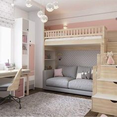 a bedroom with bunk beds, desk and stairs to the second floor is decorated in pastel colors