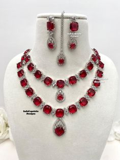 2 layered American Diamond Necklace Set / CZ Necklace/Indian Jewelry/ Reception Jewelry/ Bollywood Jewelry/double layer necklace/Silver red All items are shipped from Brampton, Ontario, Canada. If you need your item by a certain day, please reach out to us for express delivery option before placing the order so that we can update the shipping for you. Standard shipping/delivery timeline Below are the estimated delivery times after the order is shipped/dispatched.  ---> USA delivery timeline * 3- Red Double Strand Jewelry For Party, Double Strand Red Jewelry For Party, Red Crystal Necklaces With Jewels, Red Double Strand Party Jewelry, Red Crystal Necklace With Jewels, Red Double Strand Necklace For Party, American Diamond Necklace Set, Brampton Ontario, American Diamond Necklaces