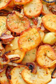 cooked potatoes with herbs and seasoning in a white dish