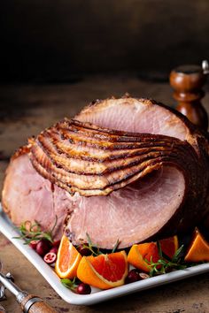 ham with oranges and cranberries on a plate