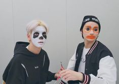 two young boys with face paint on their faces