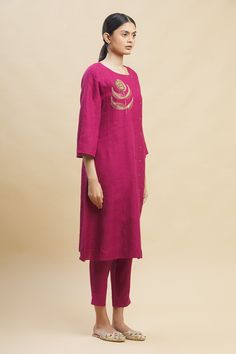 Fuschia tunic with placement floral embroidered motif and asymmetric button placket.
Components:1
Neckline:Round
Sleeve Length:Three quarter
Fabric:100% Linen
Color:Pink
Note: Pant worn by the model is not for sale - Aza Fashions Long Sleeve Tunic With Embroidered Hem, Long Sleeve Chanderi Kurta With Embroidered Neckline, Festive Tunic With Embroidered Neckline And Straight Kurta Shape, Long Sleeve Kurta With Floral Embroidery For Work, Long Sleeve Floral Embroidery Kurta For Work, Festive Straight Kurta Tunic With Embroidered Neckline, Chanderi Kurta With Embroidered Neckline And Long Sleeves, Elegant Festive Kurta With Embroidered Hem, Elegant Salwar Kameez With Embroidered Neckline