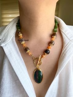 ✨Gold-Plated Toggle Clasp Pendant with Aventurine, Agate, and Orange Jade - 18 Inches Add a bold touch to your jewelry collection with our Chunky Natural Agate Aventurine and Orange Agate Necklace. Featuring a striking agate pendant and a mix of vibrant gemstones, this boho-inspired piece is perfect for making a statement. 🔸 Natural Agate, Aventurine, and Orange Agate: This necklace showcases a captivating blend of natural agate, aventurine, and orange agate stones. Each gemstone is chosen for Design Inspired By Nature, Pendant Making, Autumn Necklace, Orange Agate, Ceramic Necklace, Toggle Necklace, Boho Aesthetic, Green Hues, Unique Beauty