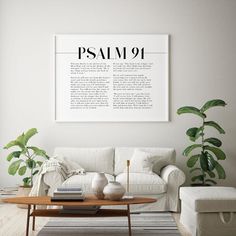 a living room with white furniture and plants on the table in front of the couch