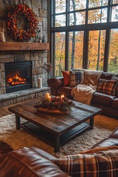 a living room filled with furniture and a fire place in front of a large window