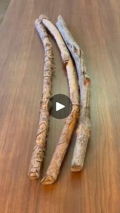 two pieces of wood sitting on top of a wooden table