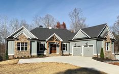 a large house with two garages in the front and one on the other side