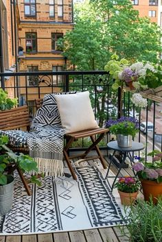 a balcony with potted plants and chairs on it