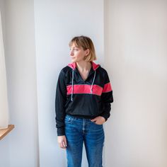 Vintage hoodie in black and pink colours.  The jumper has front pockets and quarter front zip Precise measurements are shown in the picture. Model usually wears size M and is 168 height. Condition: excellent vintage condition.  Every piece in this shop is hand selected from different places.   All those garments are bought second hand, that is why they are always unique and sometimes might have imperfections.  Choose circular fashion over fast fashion and create your own style. I hope you love y Black Half-zip Hoodie, Black Half-zip Hoodie With Drawstring Hood, Black Half-zip Hoodie Sportswear, Black Athleisure Hooded Jacket With Kangaroo Pocket, Black Hooded Jacket With Kangaroo Pocket For Athleisure, Black Sporty Hoodie Windbreaker, Sporty Black Hoodie Windbreaker, Sporty Pink Windbreaker With Adjustable Hood, Sporty Pink Outerwear With Kangaroo Pocket