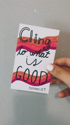 a hand holding a piece of paper that says, cling to what is good