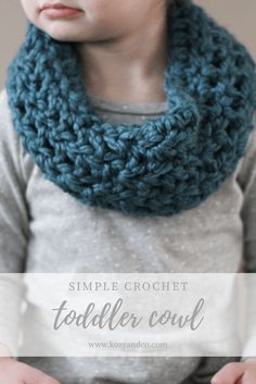 a child wearing a blue crochet cowl with the text, simple crochet toddler cowl