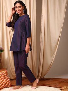 This Purple Top with Trouser Co-Ords is a versatile and stylish addition to any wardrobe. The purple solid color adds a pop of color, while the mid-rise trousers provide a comfortable fit. The round neck and three quarter sleeves on the top give it a classic look, and the slip-on closures make it easy to wear. Perfect Casual Purple Sets For Workwear, Casual Purple Workwear Set, Purple Long Sleeve Sets For Workwear, Purple Long Sleeve Workwear Sets, Purple Long Sleeve Sets For Work, Purple Solid Color, Western Kurtis, Trouser Co Ord, Eid Collection