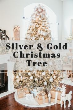 silver and gold christmas tree with presents under it