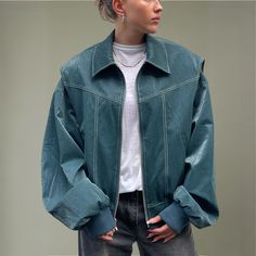 Make a statement with this oversized green leather jacket. This stunning piece embodies the perfect blend of classic and grunge. This jacket is meticulously crafted with great attention to detail. It exudes confidence and style that is bound to turn heads wherever you go. It offers comfort and a unique edge with its thoughtfully designed pockets and premium leather, balancing both functionality and fashion-forward sensibility. Product details: Vegan Leather Contrast stitch Oversized Silhouette Green Leather Jacket, Green Leather Jackets, Oversized Silhouette, Stitching Leather, Contrast Stitch, Green Leather, Dress Collection, Vegan Leather, Fashion Forward