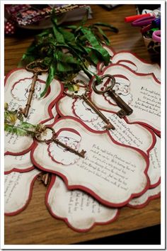 there are many keys on the table with flowers and writing in it, as well as some plants