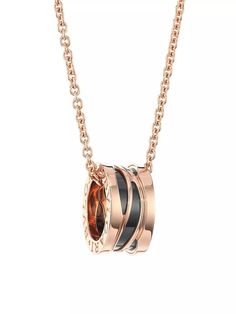 From the B.zero1 Collection. Notched round pendant embossed with a signature logo detail adorns this 18K rose gold chain..Ceramic.18K rose gold.Lobster clasp.Made in Italy.SIZE.Length, about 15' to 18'.ABOUT THE BRAND.Founded in Italy in 1884 by Greek silversmith Sotirio Bulgari, BVLGARI has become synonymous with unparalleled craftsmanship and exquisite jewelry. The brand's Roman heritage can be seen in pieces inspired by the city’s architecture, artwork and ancient mosaics. Today, the house continues to translate its rich history into opulent designs and fragrances..From the B.zero1 Collection. Notched round pendant embossed with a signature logo detail adorns this 18K rose gold chain.Ceramic18K rose goldLobster claspMade in ItalySIZELength, about 15' to 18'ABOUT THE BRANDFounded in Ital Luxury Rose Gold Jewelry With Adjustable Chain, Luxury Rose Gold Jewelry With Clavicle Chain, Luxury Rose Gold Clavicle Chain Jewelry, Luxury Rose Gold Round Pendant Necklace, Luxury Rose Gold Round Pendant Jewelry, Luxury Jewelry With Shiny Finish Round Pendant, Luxury Shiny Round Pendant Jewelry, Luxury Round Pink Gold Necklace, Luxury Necklace With Shiny Finish