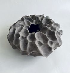 a large gray object sitting on top of a white table