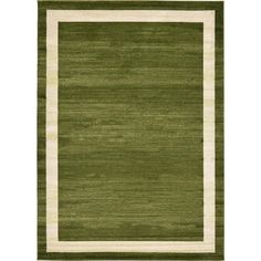 a green rug with white border