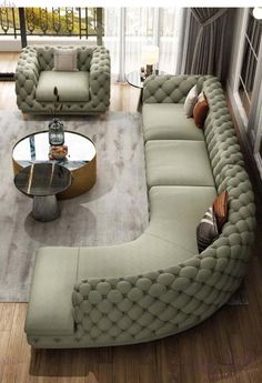 a living room filled with lots of furniture and a glass table on top of a hard wood floor