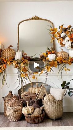 a mantel decorated with pumpkins, gourds and other fall decor items