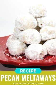 a red plate filled with powdered sugar covered donuts and the words recipe pecan meltaways