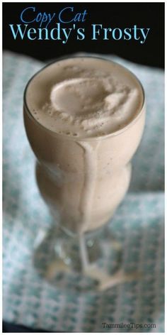 a close up of a drink in a glass on a table with the title copy cat wendy's frosty