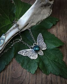 This sterling silver moth pendant necklace was inspired by my visit to Deyrolle's Emporium in Paris. The moth is etched into the surface of the silver by hand using acid etch process and is set with a smooth Labradorite gemstone, that has a bright blue flash and is finished with a loop & bar clasp. Each etched design is unique so may vary slightly. Every Under the Velvet Moon design arrives wrapped ready to be given as a gift. Silver Butterfly Nature-inspired Jewelry, Nature-inspired Sterling Silver Butterfly Jewelry, Unique Silver Butterfly Pendant Necklace, Bohemian Butterfly Sterling Silver Necklace, Handmade Silver Butterfly Necklace, Unique Handmade Silver Butterfly Necklace, Bohemian Sterling Silver Butterfly Necklace, Unique Silver Butterfly Necklace, Spiritual Silver Butterfly Necklace