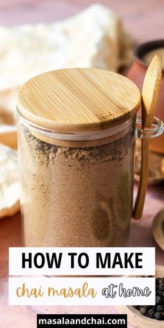 a wooden spoon sitting in a jar filled with sand