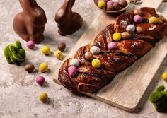 chocolate bunny bread on a cutting board with easter candies in the shape of rabbits