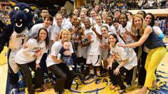 the women's basketball team is posing for a photo with their coach and mascot