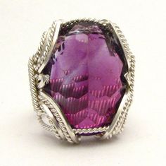 "Bold Handmade Sterling Silver Wire Wrapped Genuine Amethyst Ring Stunning Deep Purple Birthstone for February Sizing and shipping is ALWAYS FREE with a 14 day \"No Questions Asked\" return policy. lifetime warranty, free sizing and cleaning for life for life. All these are explained in the description below or feel free to reach out to us. Gemstone sizes available: S (18x13mm 3/4x1/2 inch 10+ct) This ring is made with real gems. I made it myself, so if you see a setting you like and want a diff Formal Amethyst Jewelry With Large Stone, Formal Large Stone Amethyst Jewelry, Handmade Fine Jewelry Amethyst Gemstones, Handmade Fine Amethyst Gemstones, Handmade Amethyst Fine Jewelry, Elegant Purple Jewelry With Large Stone, Gift White Gold Amethyst Ring With Gemstone Accents, Elegant Amethyst Crystal Ring With Stone Setting, White Gold Amethyst Ring With Gemstone Accents For Gift