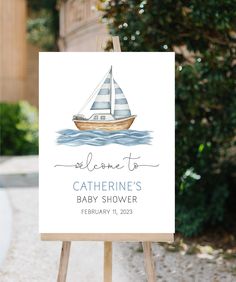 a welcome sign for a baby shower with a sailboat on it