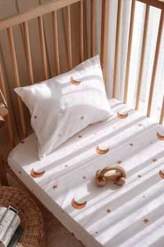 Create a dreamy nursery with our Organic Cotton Satin Fitted Baby Sheets, featuring a whimsical sky, star, and moon pattern. These soft and durable crib sheets, made from organic cotton satin, are perfect for your toddler's comfort. As unique baby gifts, they offer both style and practicality, making bedtime a celestial experience for your little one. ✨ Product Features ✨ Made from 100% Organic Cotton Satin fabric Crib & Twin Size Sheet set includes a baby pillowcase, varying with sheet size Ful English Woodland, Bedding Toddler, Single Bedding Sets, Baby Pillow Case, Baby Duvet, Toddler Bedding, Baby Sheets, Toddler Bed Set, Nursery Bedding Sets