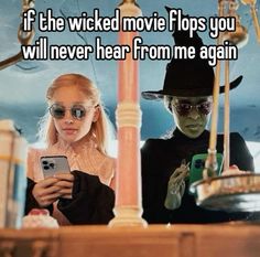 two people dressed up as witches texting on their cell phones with the caption if the